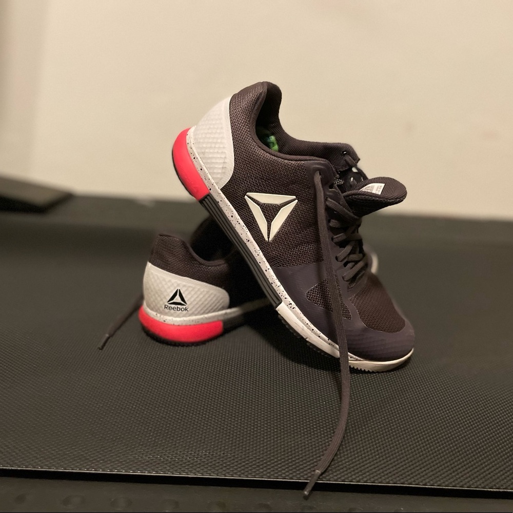 Purple, white, & neon pink Reebok cross training shoes